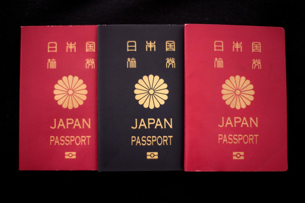 This photo illustration taken on December 19, 2018 shows covers of Japan passports in Tokyo. - Japan is one of around 50 countries in the world that allows only one nationality. (Photo by Behrouz MEHRI / AFP) / TO GO WITH Japan-nationality-politics, FOCUS by Oceane CORNEVIN        (Photo credit should read BEHROUZ MEHRI/AFP/Getty Images)