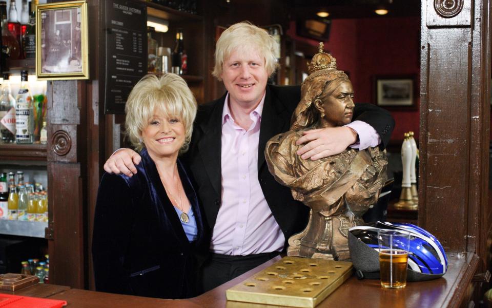 The then-Mayor of London, Boris Johnson, visited the iconic Queen Vic pub where Peggy was landlady - BBC/PA Wire