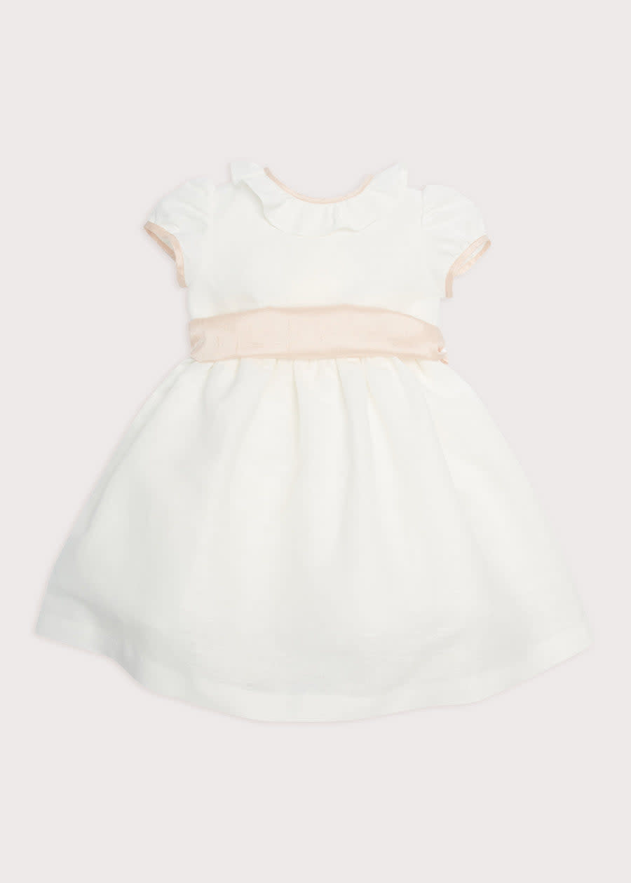 <p><a href="https://pepalondon.com/products/flower-girl-white-dress-pink-silk-sash" rel="nofollow noopener" target="_blank" data-ylk="slk:Shop Now;elm:context_link;itc:0;sec:content-canvas" class="link ">Shop Now</a></p><p>Flower Girl Ivory Dress with Pink Silk Sash</p><p>$460.00</p><p>pepalondon.com</p><span class="copyright">Product Shot Image</span>