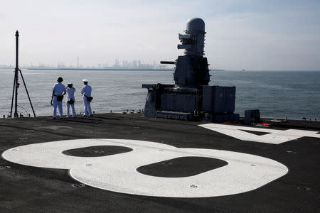 Sailors on the flight deck of Japanese helicopter carrier Kaga prepare for the ship's arrival at Colombo port in Sri Lanka, September 30, 2018. Picture taken September 30, 2018. REUTERS/Kim Kyung-Hoon