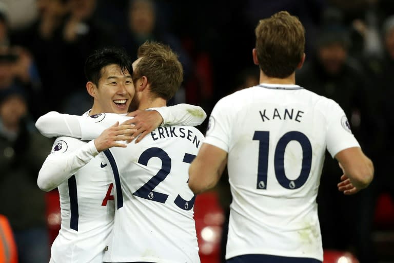 Tottenham Hotspur's Son Heung-Min (L) celebrates with teammates after scoring a goal during their English Premier League match against Brighton and Hove Albion, at Wembley Stadium in London, on December 13, 2017