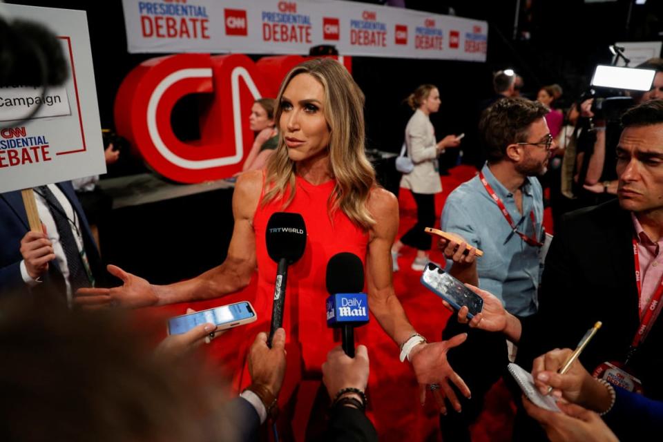 Lara Trump speaks with reporters after Donald Trump and Joe Bided debated each other in Atlanta.