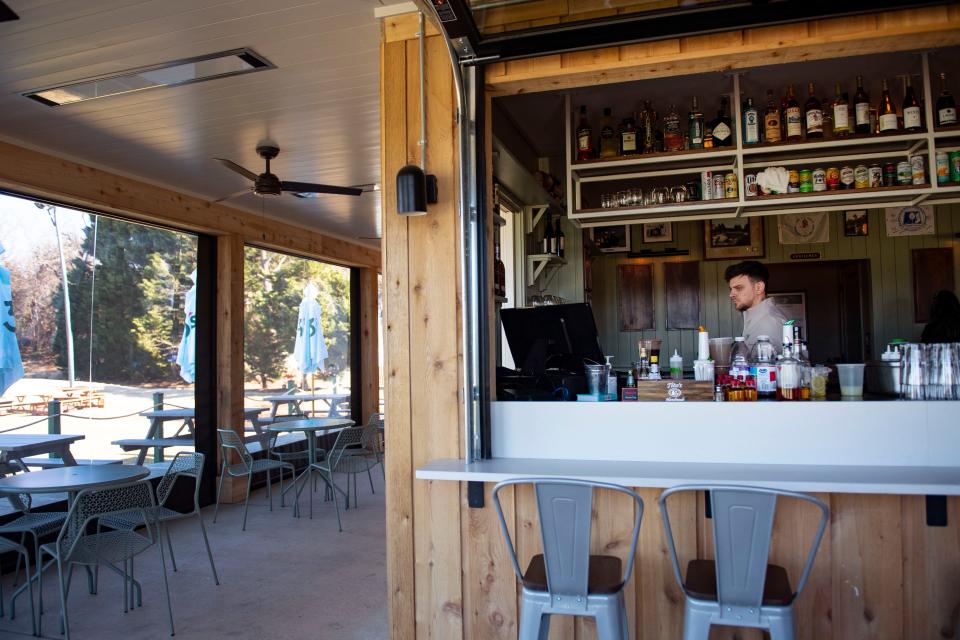 Keith Perkins, general manager at The Grubhouse at 3's Greenville Golf, prepares for a grand opening event at the restaurant on Wednesday, Jan. 10, 2024.