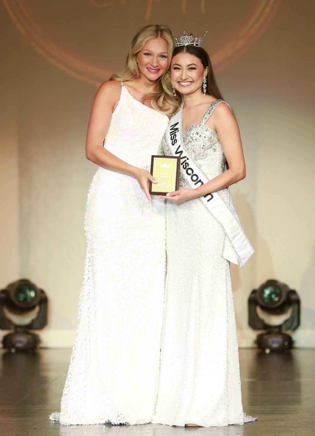 Miss Northern Lights Mandi Genord (left) receiving her preliminary Talent Award from reigning Miss Wisconsin Lila Szyryj.