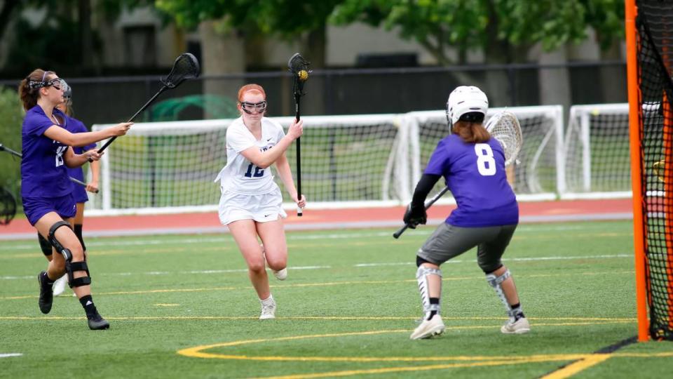 Sayre’s Avery Luring, center, looked to exploit a gap against Bowling Green in the Commonwealth Lacrosse League Girls State Championship at Transylvania University’s Pat Deacon Stadium on Saturday. Jared Peck/jpeck@herald-leader.com