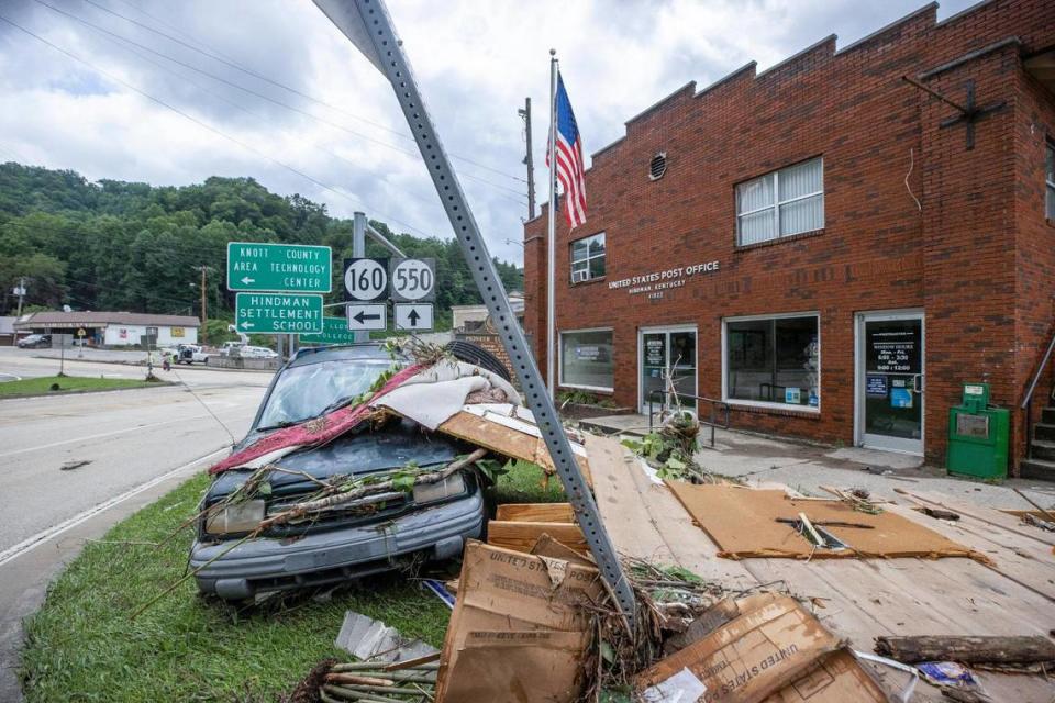 A vehicle and flood debris sit outside the post office in Hindman, Ky., on Thursday, July 28, 2023.