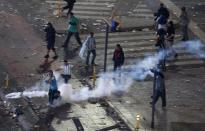 Argentina's fans clash with riot police after Argentina lost to Germany in their 2014 World Cup final soccer match in Brazil, at a public square viewing area in Buenos Aires, July 13, 2014. (REUTERS/Andres Stapff)