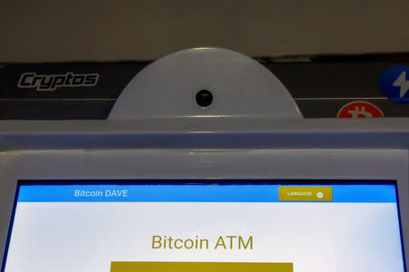 FILE PHOTO: A Bitcoin ATM is seen at the Bitcoin Center NYC in New York City, U.S. on November 27, 2017. REUTERS/Brendan McDermid/File Photo