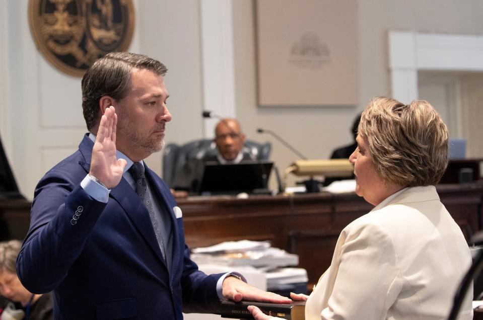 Michael Gunn, principle at Forge Consulting, gives the witness oath by Rebecca Hill during Alex Murdaugh's double murder trial at the Colleton County Courthouse on Wednesday, Feb. 8, 2023, in Walterboro, S.C. The 54-year-old attorney is standing trial on two counts of murder in the shootings of his wife and son at their Colleton County home and hunting lodge on June 7, 2021. (Andrew J. Whitaker/The Post And Courier via AP, Pool)