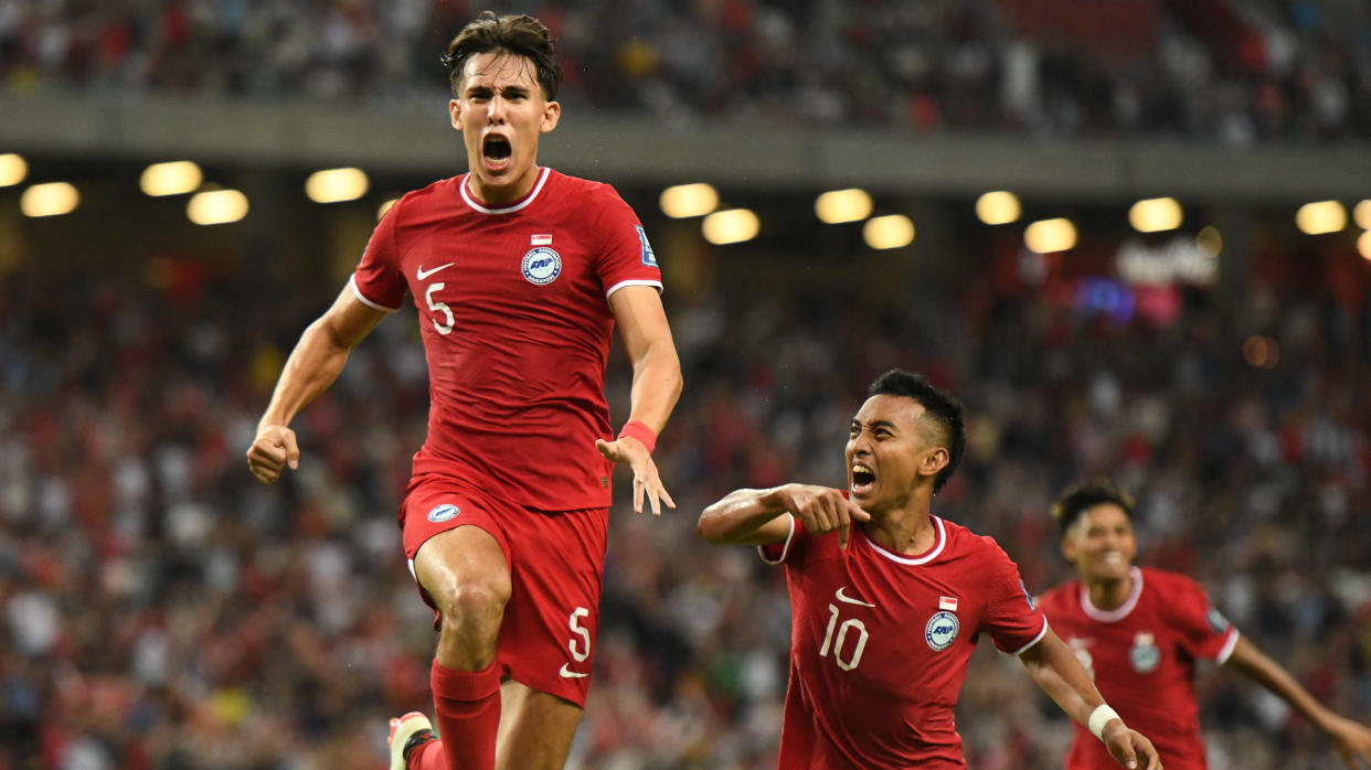 Singapore's Jacob Mahler (left) celebrates after scoring his team's second goal in the 2026 FIFA World Cup Asian qualifier against China at National Stadium in Singapore.