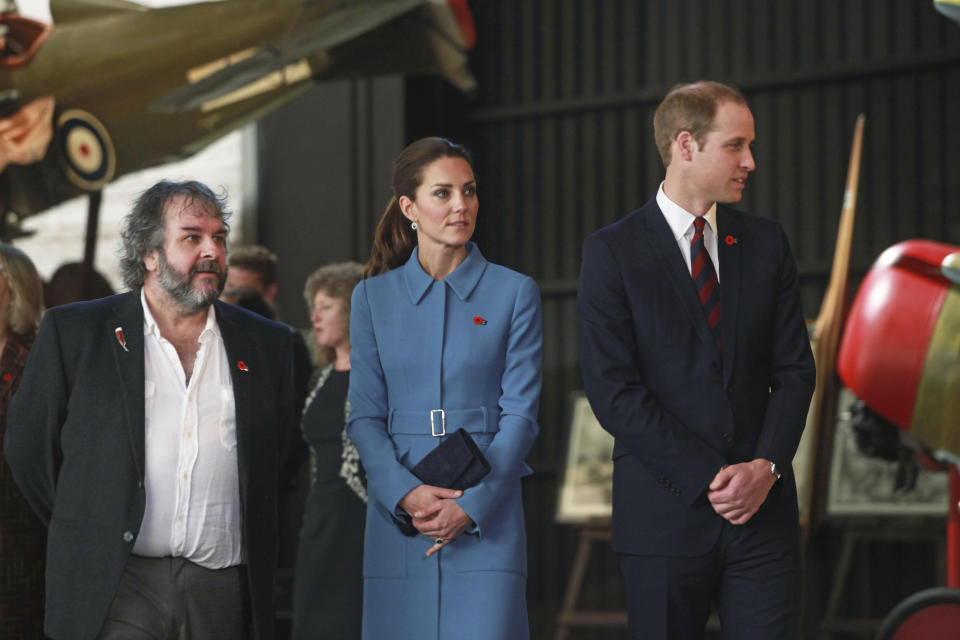 Britain's Prince William, right, and his Kate, the Duchess of Cambridge, are guided on a tour of the Omaka Aviation Heritage Centre by film director Peter Jackson, in Blenheim, New Zealand, Thursday, April 10, 2014. (AP Photo/Tim Cuff, Pool)