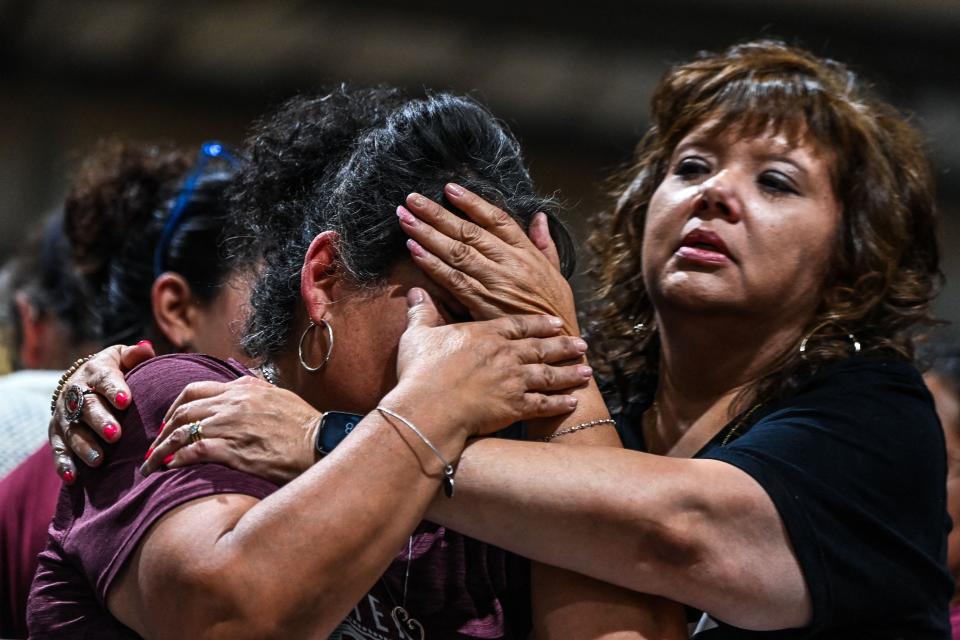 TOPSHOT - A woman cries as she attends the vigil for the victims of the mass shooting at Robb Elementary School in Uvalde, Texas on May 25, 2022. - The tight-knit Latino community of Uvalde was wracked with grief Wednesday after a teen in body armor marched into the school and killed 19 children and two teachers, in the latest spasm of deadly gun violence in the US. (Photo by CHANDAN KHANNA / AFP) (Photo by CHANDAN KHANNA/AFP via Getty Images) ORG XMIT: 0 ORIG FILE ID: AFP_32B64YY.jpg