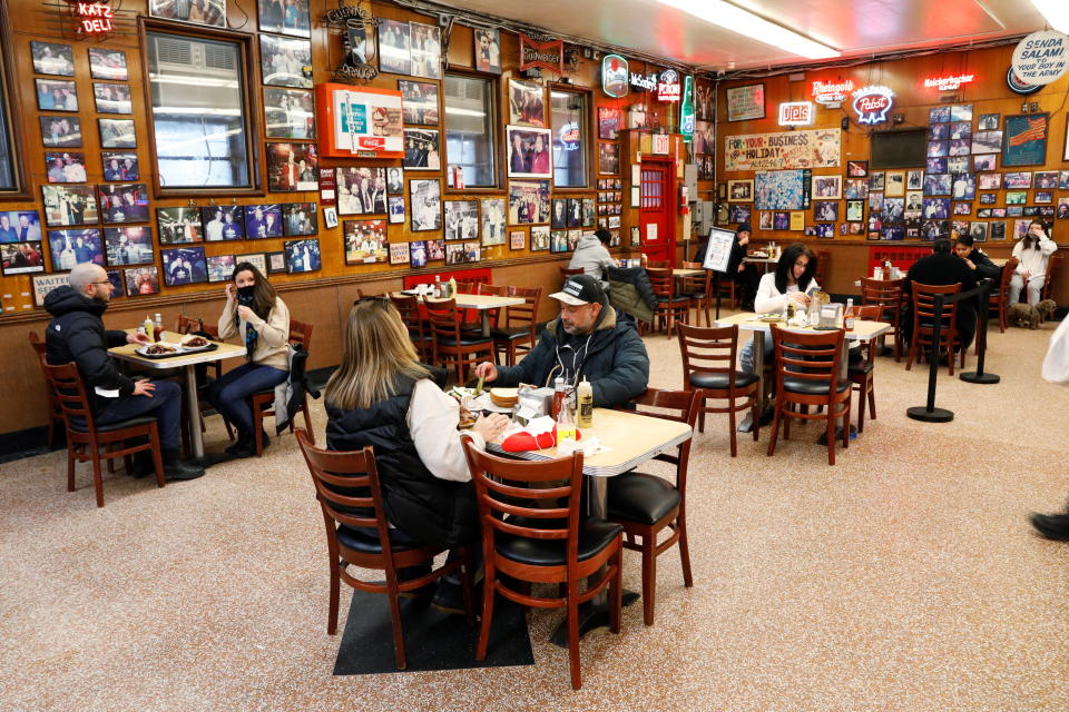 Patrons enjoy lunch at Katz's Delicatessen, the famous deli founded in 1888, on the first day of the return to indoor dining for New York City, during the coronavirus disease (COVID-19) pandemic, in New York U.S., February 12, 2021.  REUTERS/Brendan McDermid