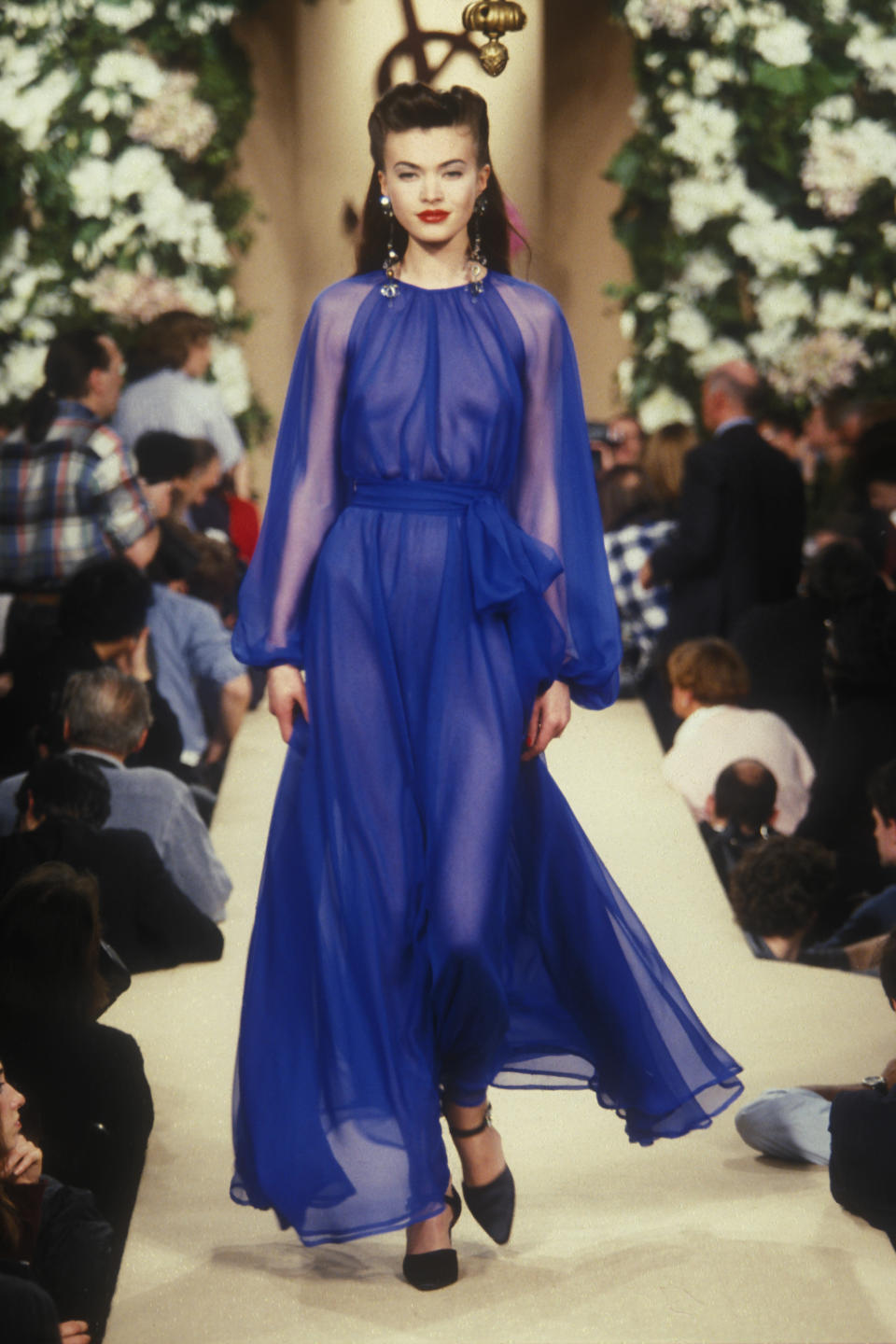 Yves Saint Laurent sheer, blue evening dress worn by Tatiana Nikiforova, spring 1996 couture collection.
