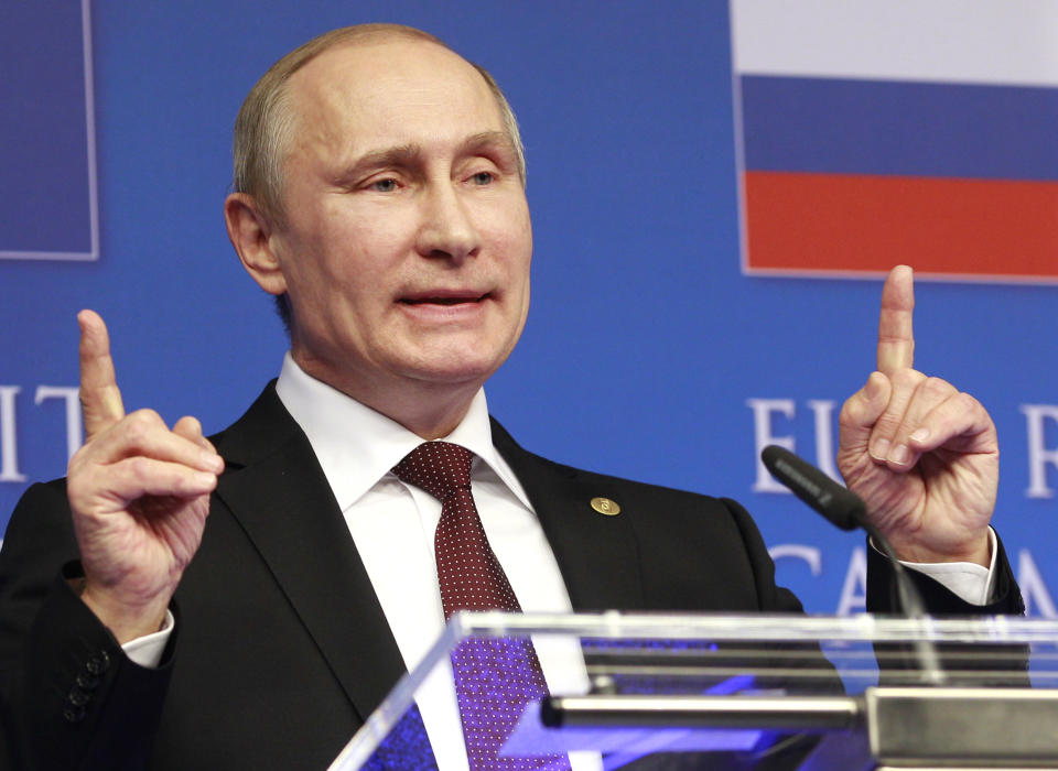 Russian President Vladimir Putin addresses the media at the end of an EU-Russia summit, at the European Council building in Brussels on Tuesday, Jan. 28, 2014. Russian President Vladimir Putin and European Union leaders are weighing the future of their common relationship at a summit that was abridged amid stark differences over Ukraine's future and other issues. (AP Photo/Yves Logghe)