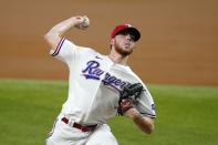 Texas Rangers starting pitcher A.J. Alexy throws to the Los Angeles Angels in the first inning of a baseball game in Arlington, Texas, Tuesday, Sept. 28, 2021. (AP Photo/Tony Gutierrez)