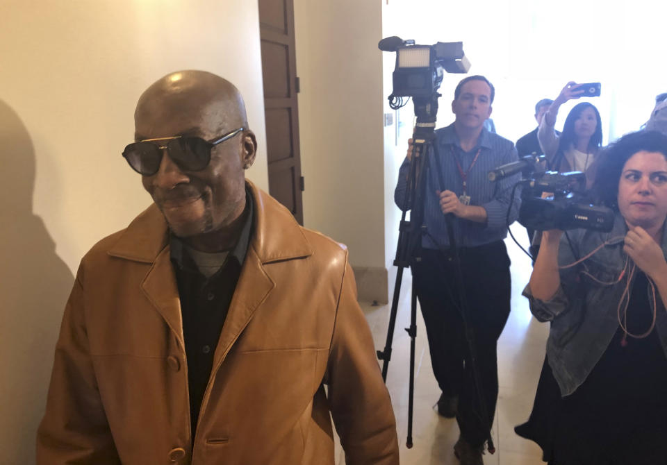 FILE - In this Oct. 10, 2018 file photo, plaintiff DeWayne Johnson, a school groundskeeper who says Roundup weed-killer caused his cancer, leaves a courtroom in San Francisco. A Northern California groundskeeper says he will accept a judge's reduced verdict of $78 million against Monsanto after a jury found the company's weed killer caused his cancer. DeWayne Johnson's attorney informed the San Francisco Superior Court on Wednesday, Oct. 31, 2018. (AP Photo/Paul Elias, File)