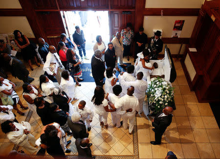 Family members pay their last respects during the funeral for police shooting victim Keith Lamont Scott at the First Baptist Church in James Island, South Carolina, U.S. October 14, 2016. REUTERS/Randall Hill