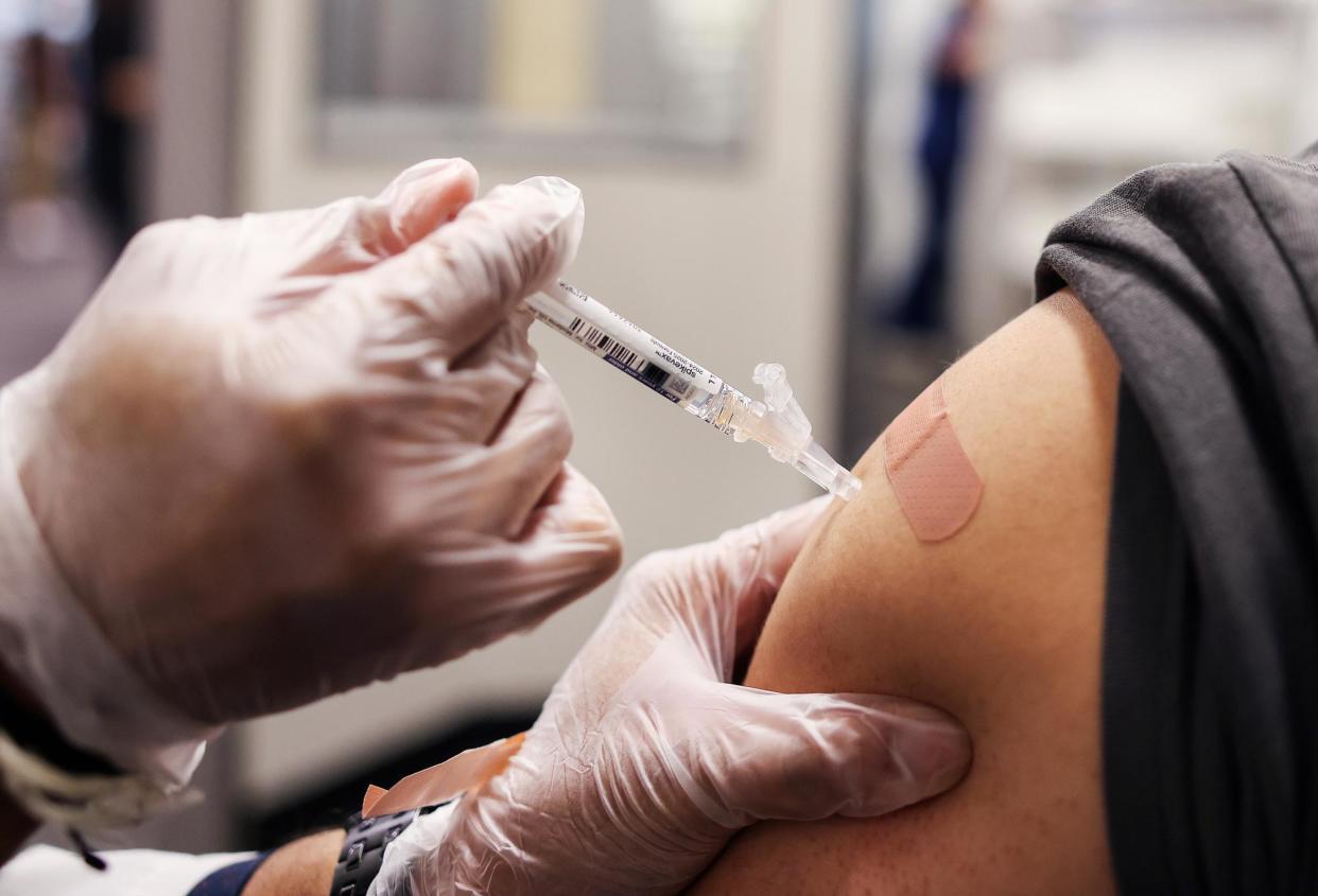 <span>A person rceives a Covid-19 vaccine at a CVS location in Huntington Park, California, last week.</span><span>Photograph: Christina House/Los Angeles Times via Getty Images</span>