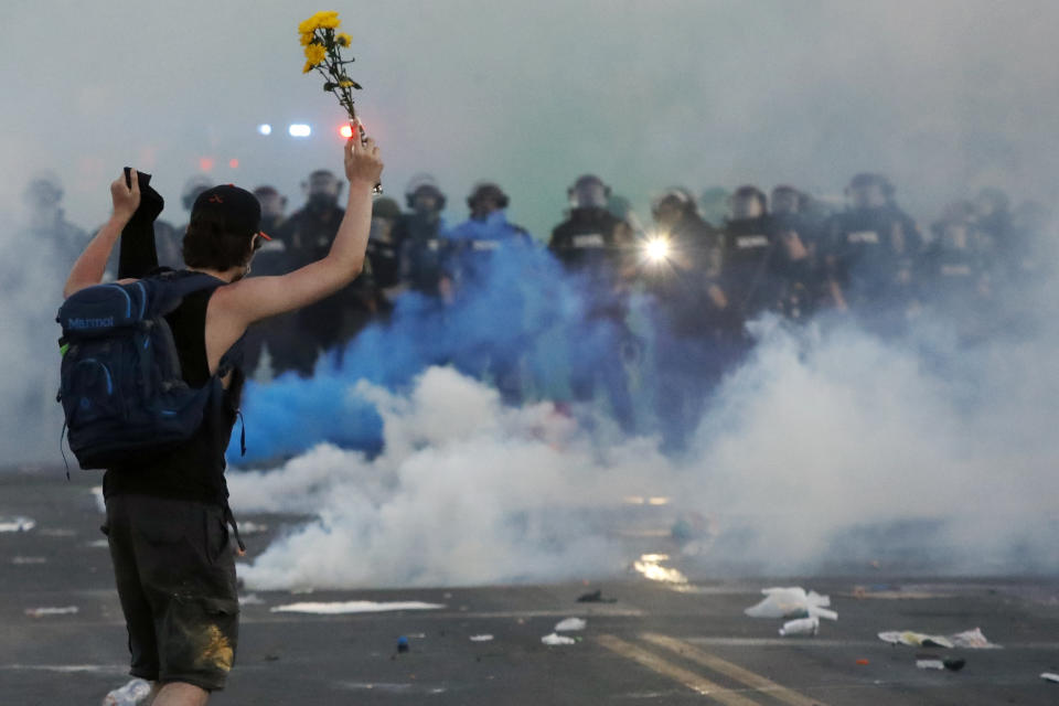 Police move toward a protester after curfew on May 30, 2020, in Minneapolis. (John Minchillo/AP)