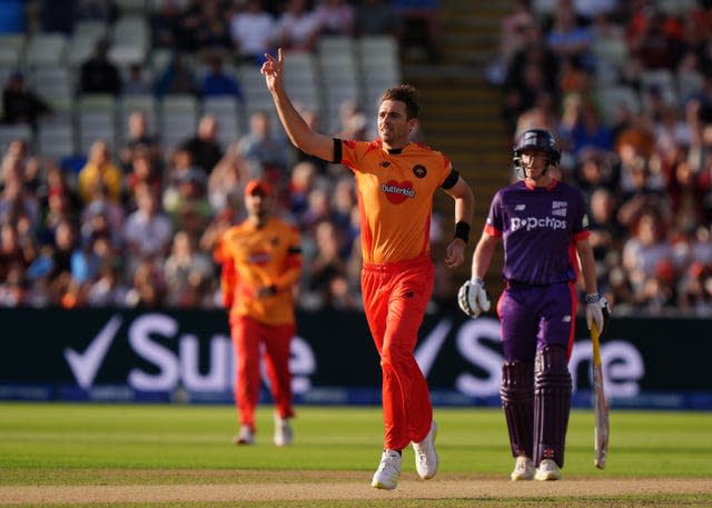 Tim Southee, with his right hand in the air, celebrates dismissing Ben Stokes 