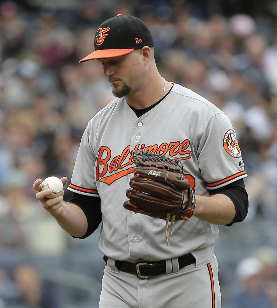 Baltimore Orioles relief pitcher Mike Wright Jr. reacts after giving up a run during the first inning of a baseball game against the New York Yankees at Yankee Stadium, Sunday, Sept. 23, 2018, in New York. (AP Photo/Seth Wenig)