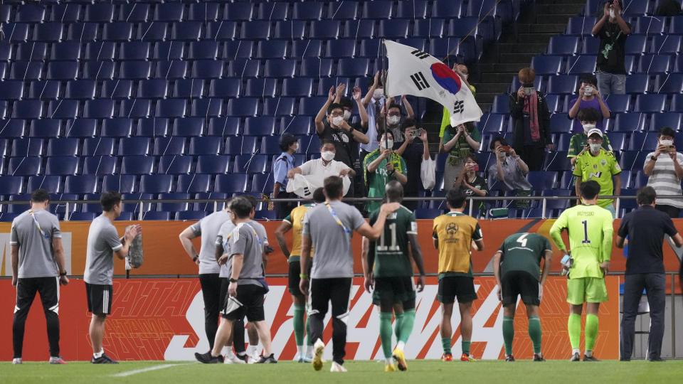 South Korea's Jeonbuk Hyundai Motors' players thank their fans following the AFC Champions League semifinal match against Japan's Urawa Red Diamonds at Saitama Stadium Thursday, Aug. 25, 2022, in Saitama, near Tokyo. (AP Photo/Eugene Hoshiko)