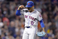 New York Mets starting pitcher Marcus Stroman celebrates after catcher Tomas Nido turned a bases-loaded double play in the third inning of a baseball game against the Boston Red Sox at Fenway Park, Tuesday, Sept. 21, 2021, in Boston. (AP Photo/Charles Krupa)