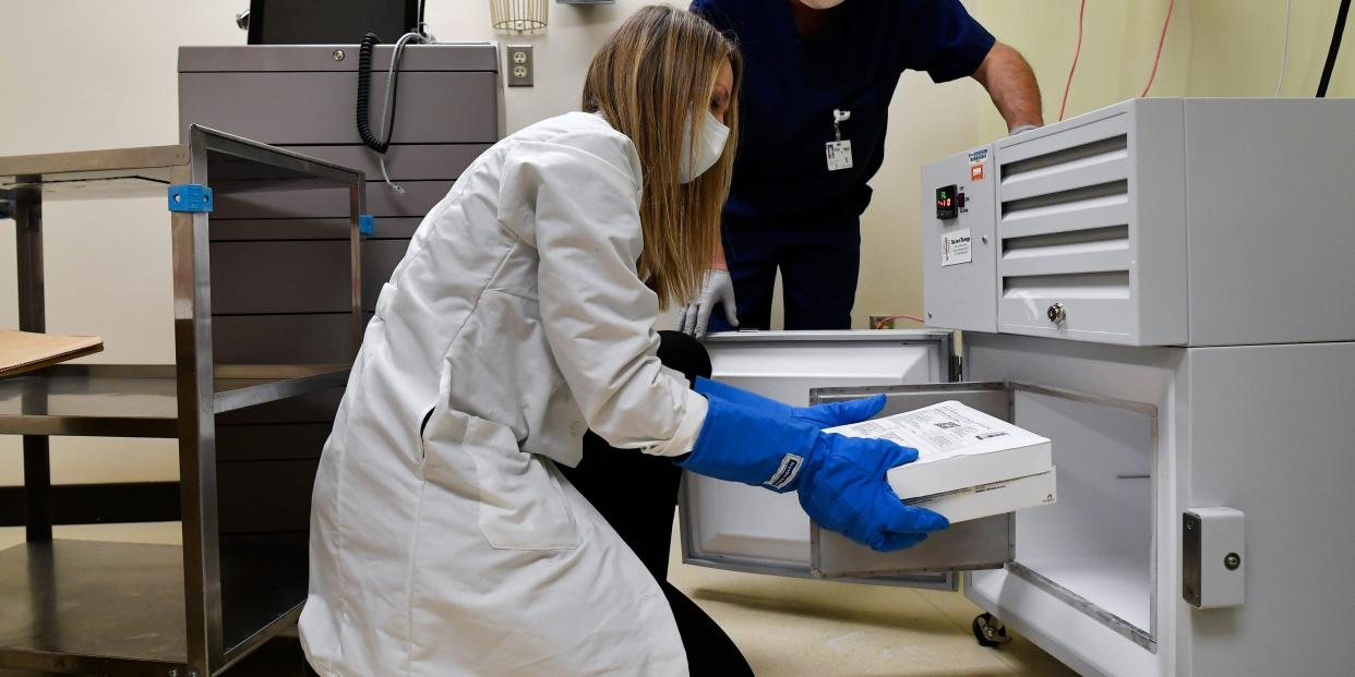 Coronavirus vaccine being put in freezer with dry ice