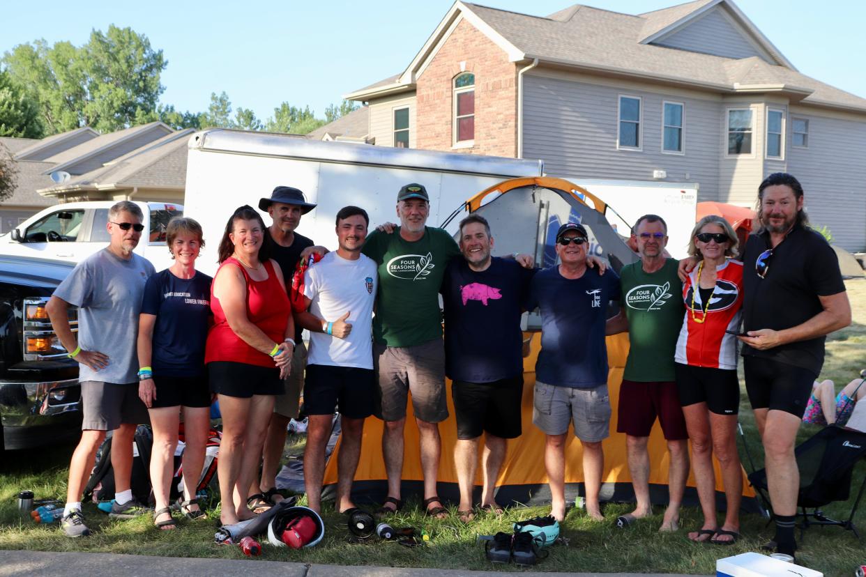 Members of the cult of Joey Flaphole pose for a photo at RAGBRAI 50 in Coralville on Friday, July 28, 2023.