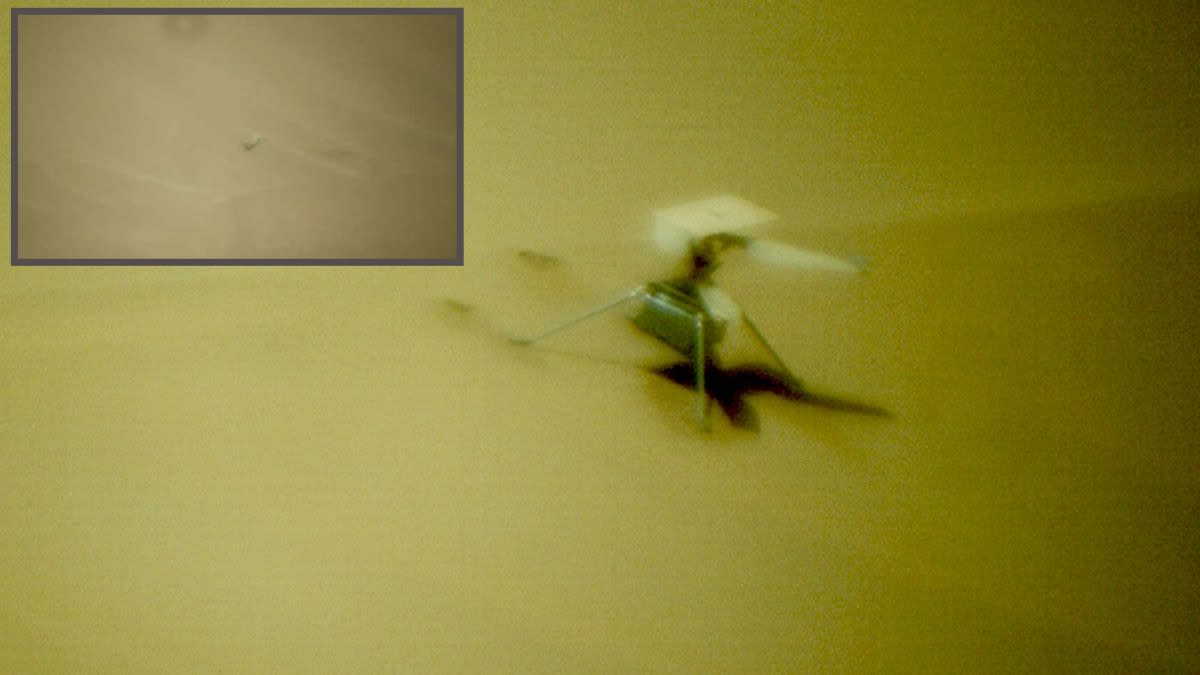  A blurry helicopter visible on the surface of mars. an inset image shows a blade on the sand. 