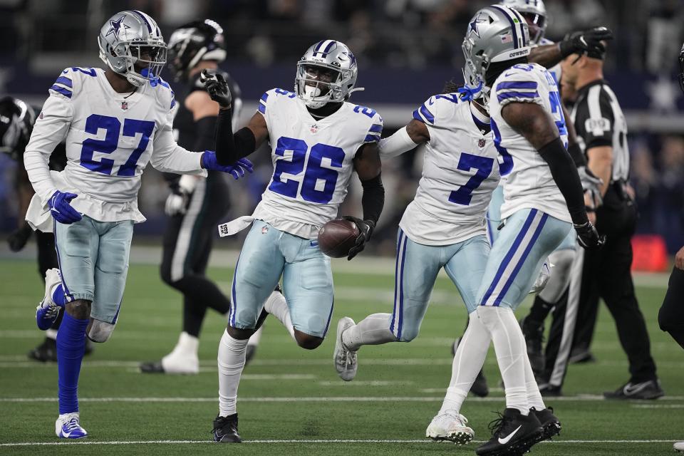 Dallas Cowboys' DaRon Bland celebrates his interception during the second half of an NFL football game against the Philadelphia Eagles Saturday, Dec. 24, 2022, in Arlington, Texas. (AP Photo/Tony Gutierrez)