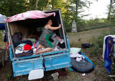 A Roma family sets up camp during the pilgrimage near the chapel in Csatka, Hungary on September 9, 2017. REUTERS/Laszlo Balogh