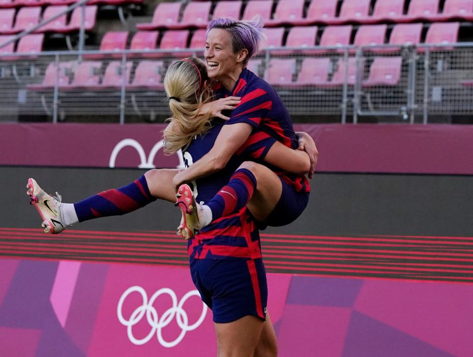 Megan Rapinoe celebrates with teammate Lindsey Horan after one of her two first-half goals in the bronze medal game.