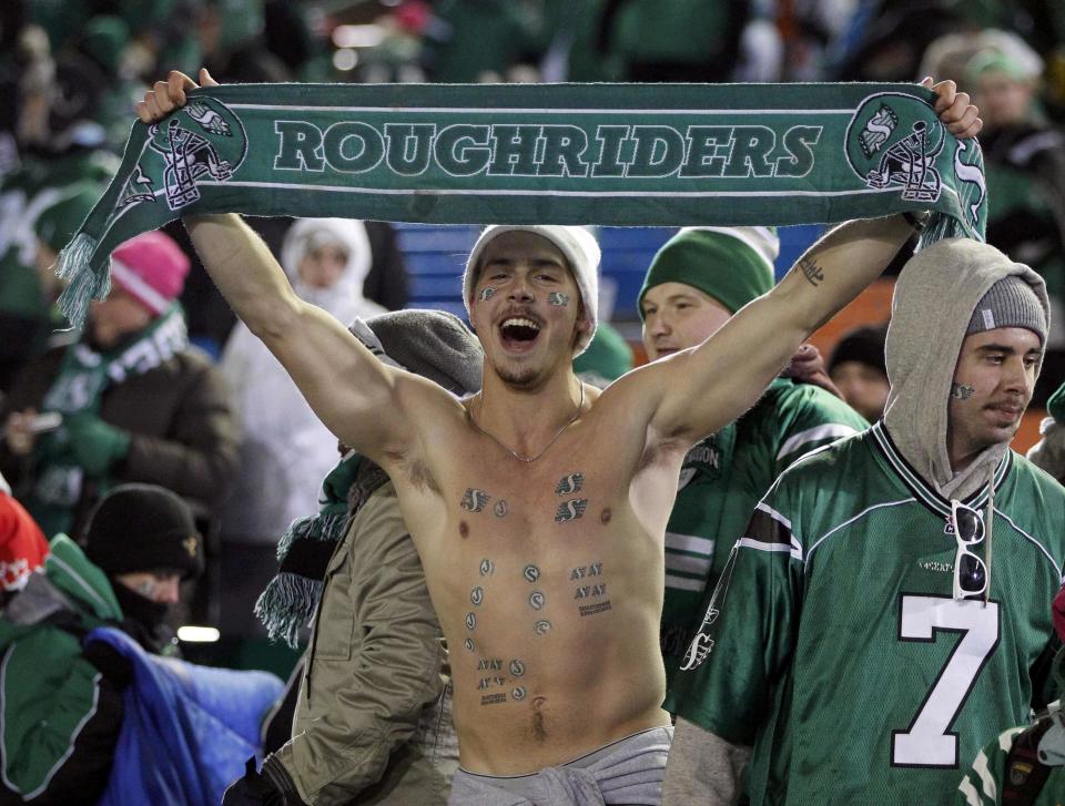 A Saskatchewan Roughriders fan celebrates after they beat the Hamilton Tiger-Cats in the CFL's 101st Grey Cup championship football game in Regina, Saskatchewan November 24, 2013. REUTERS/David Stobbe (CANADA - Tags: SPORT FOOTBALL)