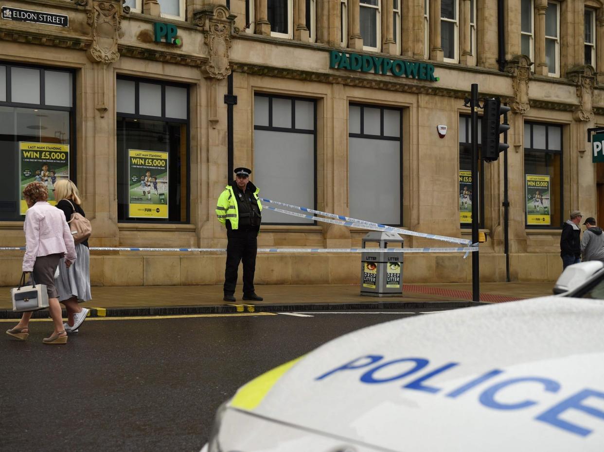 A police officer stands on duty by a police cordon on Eldon Street, following a stabbing incident in the centre of Barnsley: AFP/Getty Images