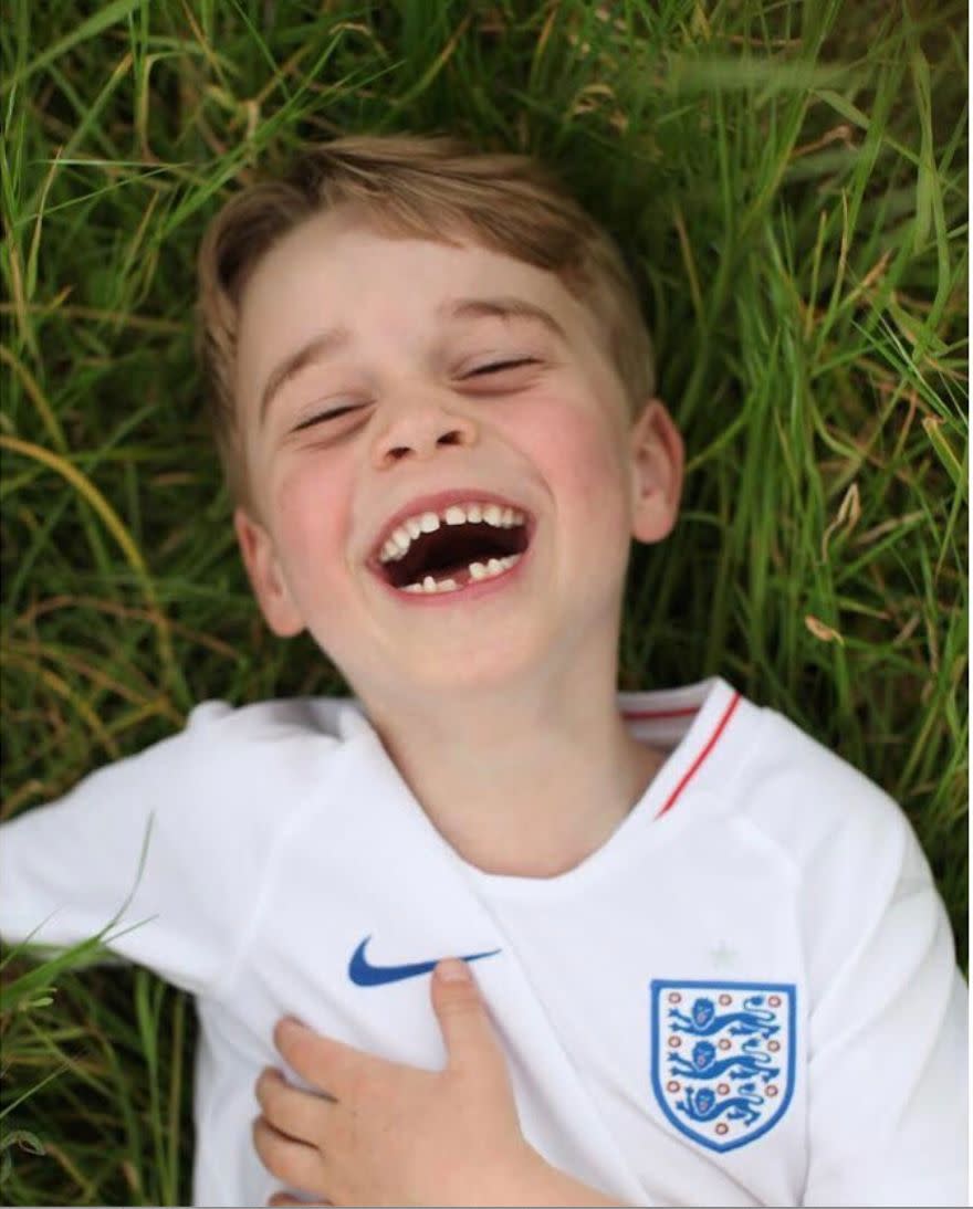 Prince George laughs in the garden of his home at Kensington Palace in this photo released ahead of his sixth birthday in July 2019.