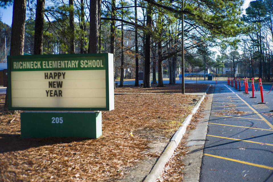 The marquee at the entrance of Richneck Elementary School wishes students and faculty a "Happy New Year" in Newport News, Va. on Monday Jan. 9, 2023. The Virginia teacher who authorities say was shot by a 6-year-old student is known as a hard-working educator who’s devoted to her students and enthusiastic about the profession that runs in her family. (AP Photo/John C. Clark)