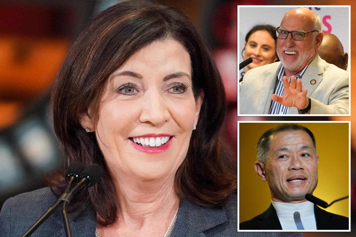 Kathy Hochul, John Liu, and Madeline Weinstein at an event, with a woman smiling at a microphone