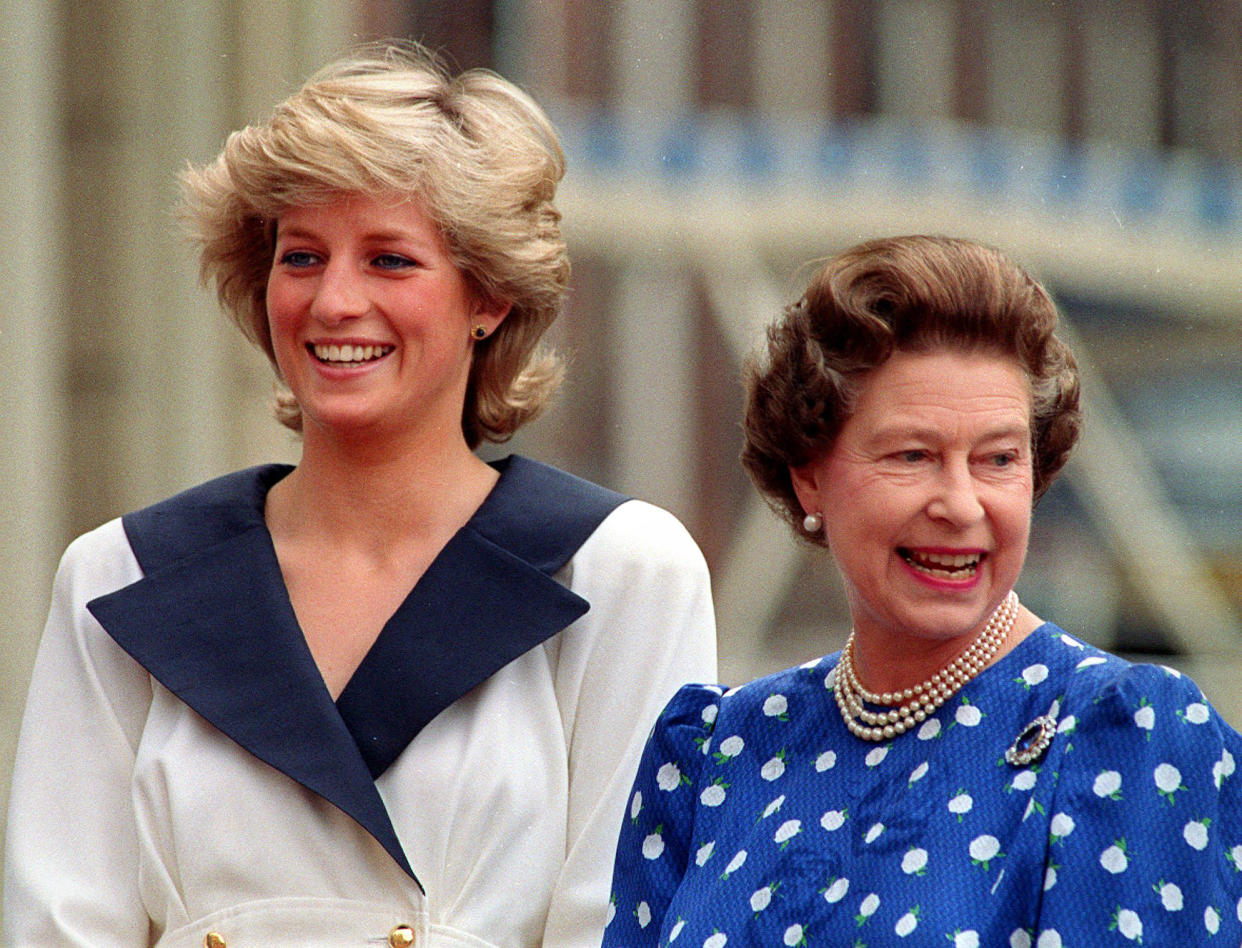 Diana, Princess of Wales, left, and Britain's Queen Elizabeth II smile to well-wishers outside Clarence House in London on Aug. 4, 1987. (Martin Cleaver/AP)
