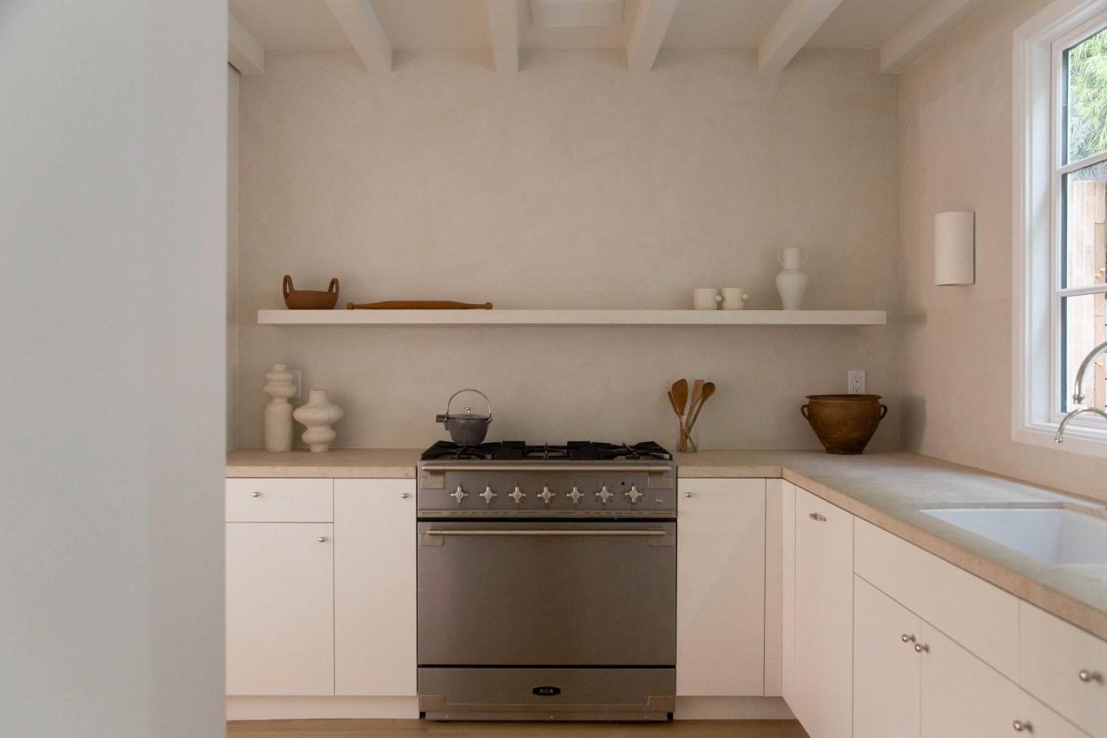  a minimalist kitchen with no countertop appliances 