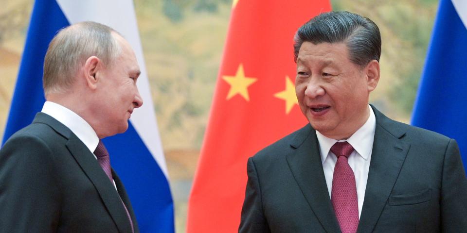 Russia's President Vladimir Putin (L) and his Chinese counterpart Xi Jinping pose during a meeting at the Diaoyutai State Guesthouse.