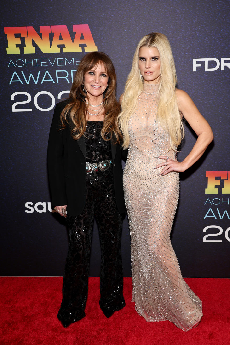 NEW YORK, NEW YORK - NOVEMBER 29: (L-R) Tina Simpson and Jessica Simpson attend the 2023 Footwear News Achievement Awards at Cipriani South Street on November 29, 2023 in New York City. (Photo by Jamie McCarthy/Footwear News via Getty Images)