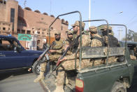 Armed army personnel guard outside the Gaddafi Stadium in Lahore, Wednesday, Jan. 22, 2020 ahead of Pakistan cricket team's practice session. The three-match Twenty20 series between Pakistan and Bangladesh starts in Lahore from Friday.AP Photo/K.M. Chaudary)