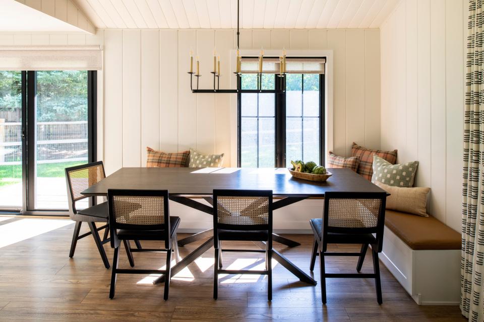 When overseeing a family getaway in Ketchum, Idaho, local designer Sarah Latham wanted to create a space that was durable enough for three boys, but still remained a relaxing retreat for the parents. Adorned with wood, jolts of plaid, and a candle pendant, the dining nook conveys that rustic, calming aesthetic while serving as a natural gathering space for family meals and game nights.