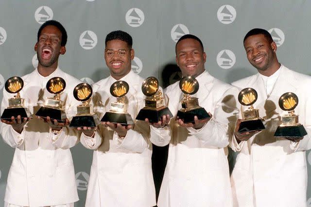 <p>DAN GROSHONG/AFP via Getty</p> Boyz II Men pose with their awards at the 37th Annual Grammys in Los Angeles in March 1995