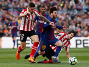 Soccer Football - La Liga Santander - FC Barcelona vs Athletic Bilbao - Camp Nou, Barcelona, Spain - March 18, 2018 Barcelona’s Lionel Messi in action with Athletic Bilbao's Unai Nunez REUTERS/Albert Gea