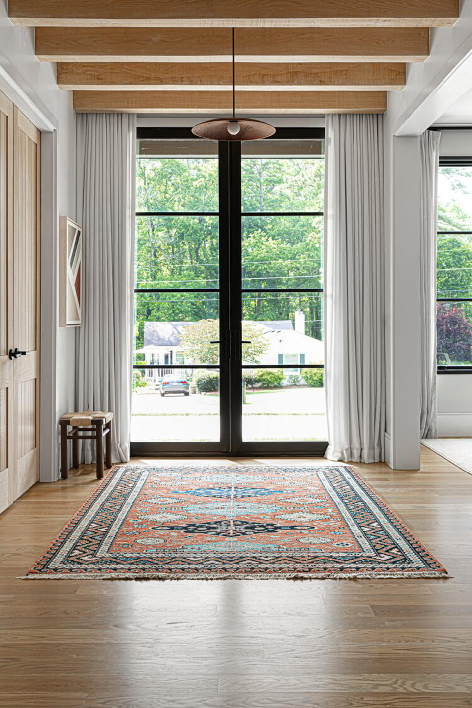 curtains touching the floor in a living room