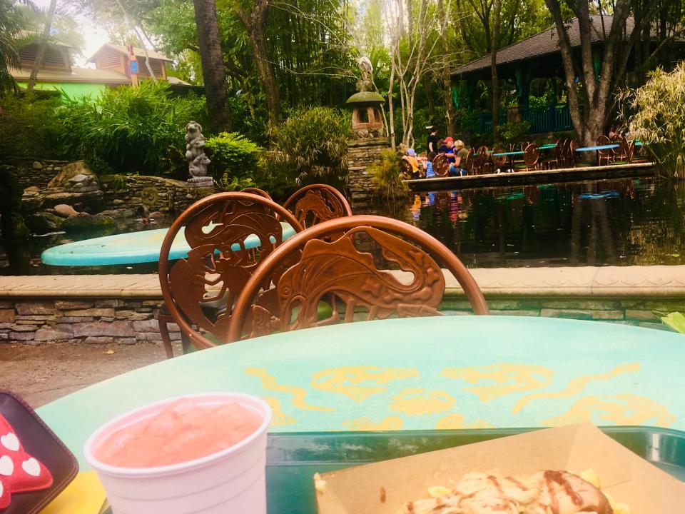 shot of tables at flame tree barbecue restaurant animal kingdom disney world