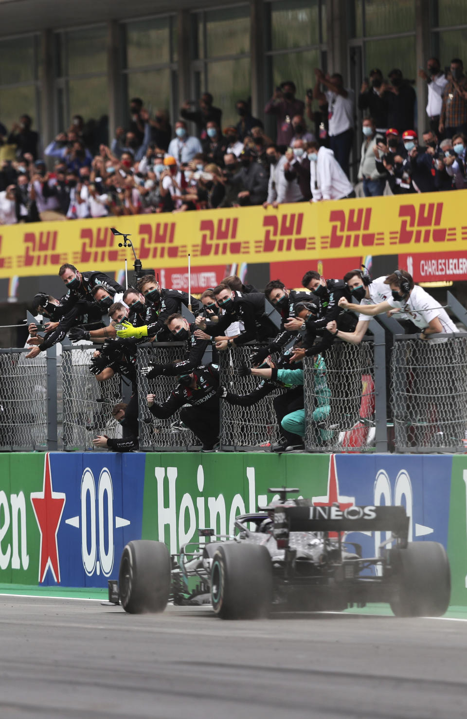 Mercedes driver Lewis Hamilton of Britain crosses the finish line to win the Formula One Portuguese Grand Prix at the Algarve International Circuit in Portimao, Portugal, Sunday, Oct. 25, 2020. (Jose Sena Goulao, Pool via AP)